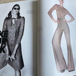 May include: A fashion magazine spread featuring two models. One model wears a gray tweed suit with a double-breasted jacket and sunglasses. The other model is in a matching knit top and wide-leg pants. The text "TAKE YOUR PICK" is visible.