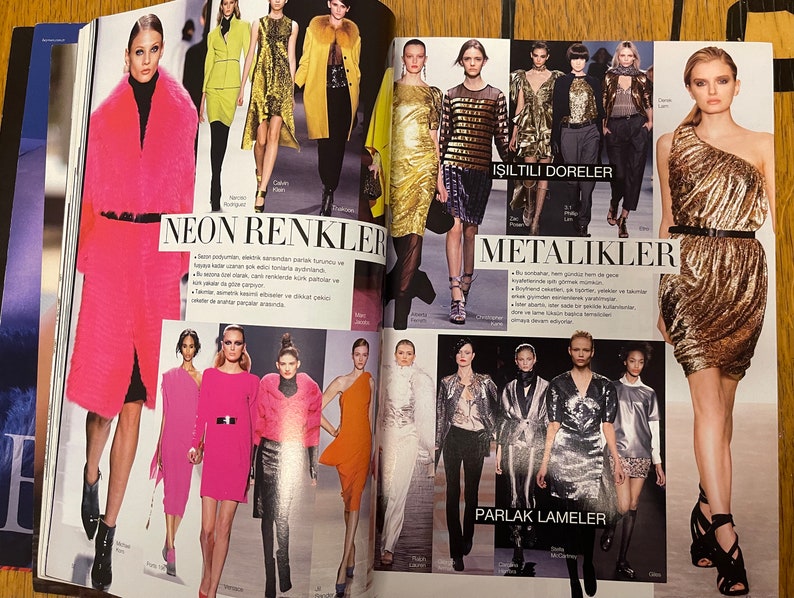 May include: A fashion magazine spread showcasing models wearing various clothing styles. The page is divided into sections with headings: "Neon Renkler", "Isiltili Doreler", "Metalikler", and "Parlak Lameler".