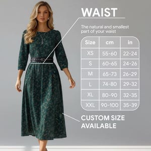 Może przedstawiać: Kobieta w ciemnozielonej sukience w kwiaty z czarnym paskiem. Obraz zawiera tabelę rozmiar&oacute;w z wymiarami w talii w cm i calach, od 55 cm do 100 cm (22-39 cali). Tekst: WAIST, CUSTOM SIZE AVAILABLE.