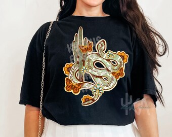 May include: Black t-shirt with a graphic print of a green snake wrapped around a cactus with yellow flowers and butterflies.