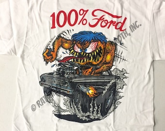 May include: White t-shirt with a cartoon illustration of a monster driving a black Ford car. The text "100% Ford" is printed in red above the illustration. The text "Roth, Inc." is printed in black on the right side of the illustration. The text "BACK" is printed in black at the bottom of the image.