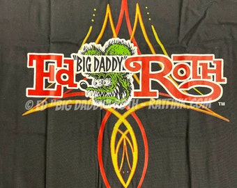 May include: Black t-shirt with a red and yellow graphic design featuring a cartoon monster with the text "Big Daddy" and "Ed Roth" in red letters.