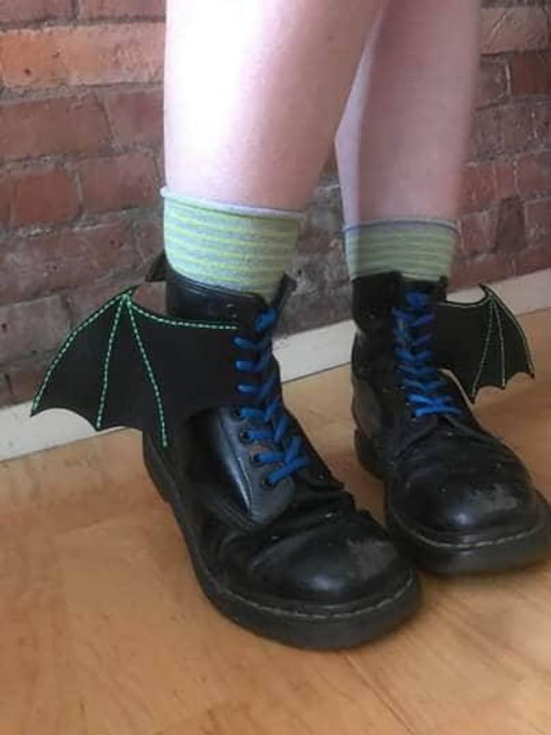 Boot Bat wings with green thread.