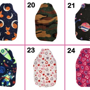 May include: Six different designs of hot water bottle covers. The covers are made of soft fleece and feature various patterns, including foxes, camouflage, planets, astronauts, and hearts.