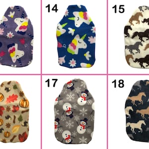 May include: Six different designs of fleece hot water bottles. The designs include unicorns, snowmen, and horses. The numbers 13, 14, 15, 16, 17, and 18 are printed on the top of each bottle.