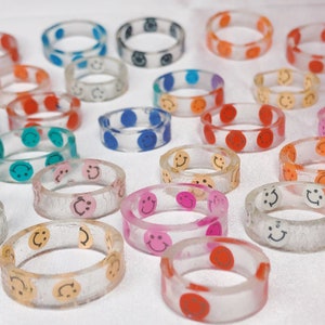 Mystery smiley face resin rings