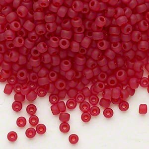 Puede incluir: Un montón grande de pequeñas cuentas de vidrio rojo opaco. Las cuentas son redondas y tienen una forma ligeramente irregular.