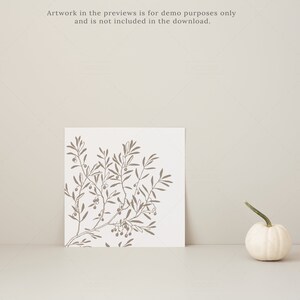 May include: A square print featuring a brown olive branch design on a white background. A small white gourd with a green stem sits to the right. The text at the top says, "Artwork in the previews is for demo purposes only and is not included in the download."
