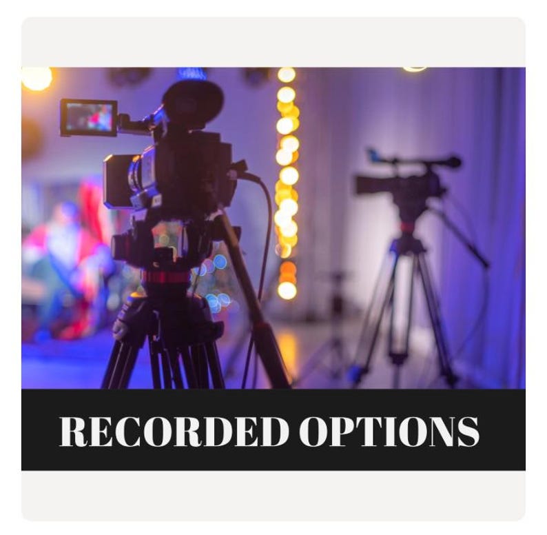 May include: Two black video cameras mounted on tripods are positioned in a studio setting with soft purple lighting and bokeh light accents. A black rectangular banner at the bottom displays the white text RECORDED OPTIONS in a serif font.