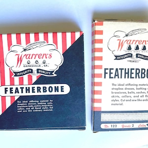 May include: Two boxes of Warren's Featherbone stiffening material. The boxes are red and white striped with black lettering. The text on the boxes reads "Warren's Featherbone" and "The ideal stiffening material for strapless dresses, bathing suits, brassieres, belts, sashes, hoop skirts, collars, and all flared styles. Cut and sew like ordinary material."
