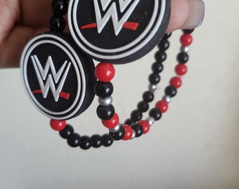 May include: Two black and red beaded bracelets with a white and red WWE logo charm on each.