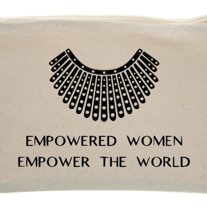 May include: A beige canvas zippered pouch with a black silhouette of a collar and the text "EMPOWERED WOMEN EMPOWER THE WORLD".