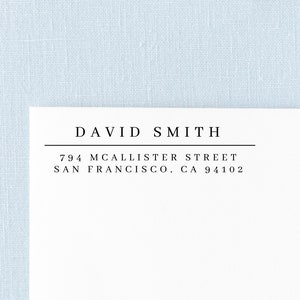 May include: A white return address label with black text. The text reads "DAVID SMITH", "794 MCALISTER STREET", and "SAN FRANCISCO, CA 94102".