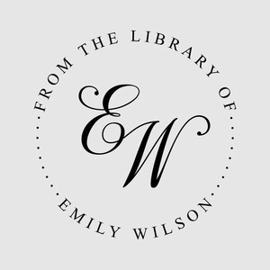 May include: A circular black ink stamp design on a light gray background featuring the elegant script initials EW in the center. The text FROM THE LIBRARY OF is arched across the top, and the name EMILY WILSON is arched across the bottom.