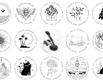 May include: A collection of circular black and white custom address stamp designs featuring various illustrations including a bee, sunflower, lighthouse, cat, and palm trees, alongside a black metal handheld embosser tool for paper.