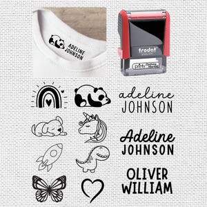 May include: A clothing marker stamp with the text "Adeline Johnson" printed on a white t-shirt. The image also shows various black and white illustrations of a rainbow, panda, dog, unicorn, rocket, dinosaur, butterfly, and heart.
