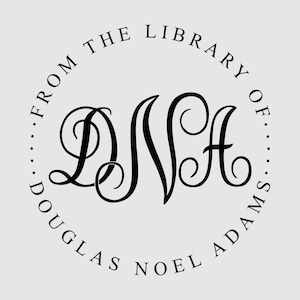 May include: A circular black ink stamp design on a light gray background. The center features the large, ornate, interconnected script letters DNA. The text FROM THE LIBRARY OF and DOUGLAS NOEL ADAMS curves along the inner border of the circle.