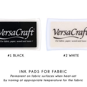 two sets of fabric ink pads, one in black and one in white, with text indicating their color and purpose.