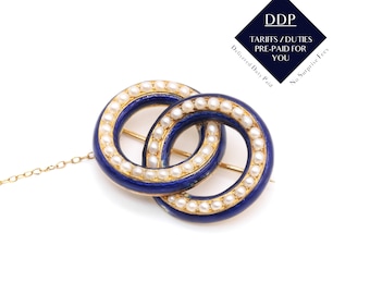 Broche georgiano de anillos entrelazados con perlas de semillas y esmalte azul cobalto en oro amarillo de 18 quilates.
