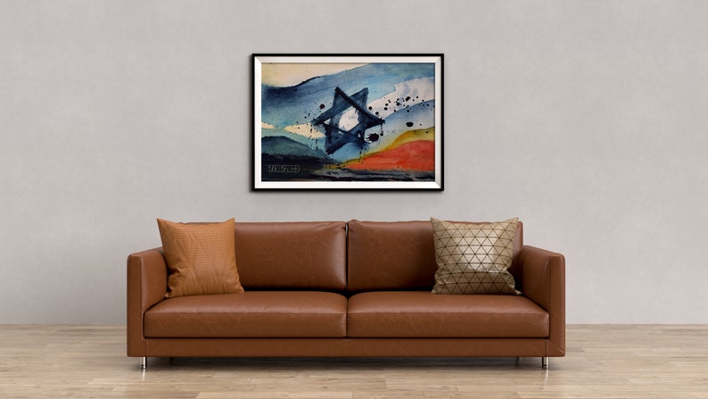May include: A framed abstract watercolor painting of a blue Star of David with a white center, set against a background of blue, white, and orange watercolor washes. The painting is framed in black and has the artist's signature in the bottom left corner.