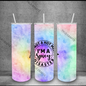 May include: Three stainless steel tumblers with a rainbow watercolour design. The centre tumbler has the text "Not a hot mess, I'm a spicy disaster" in black.