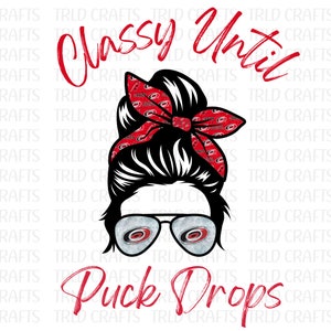 May include: A black and white illustration of a woman with a messy bun wearing a red and black bandana with a hockey team logo. The bandana is tied around the bun. The woman is wearing sunglasses with the same hockey team logo on the lenses. The text "Classy Until Puck Drops" is written in red letters below the woman.