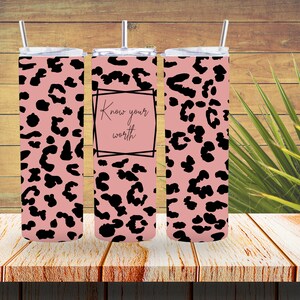 May include: Three pink and black leopard print stainless steel tumblers with lids and straws. The middle tumbler has the text "Know your worth" in a black frame.