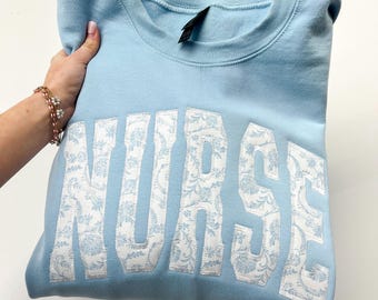 NURSE Embroidered Applique Light Blue Grand Millennial sweatshirt. NURSE blue floral sweatshirt embroidery Tee shirt
