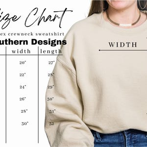 May include: Size chart for a unisex crewneck sweatshirt. The chart shows the width and length measurements in inches for sizes S, M, L, XL, 2XL, and 3XL.