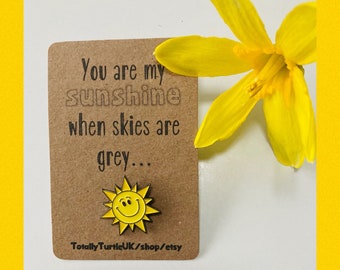 Smiling happy Sunshine pin badge. Well being friend/family gift