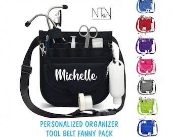 May include: Black personalized tool belt fanny pack with the name "Michelle" in white script. The organizer has multiple pockets and a strap. Additional color options are shown, including blue, red, purple, pink, gray, green, and blue.