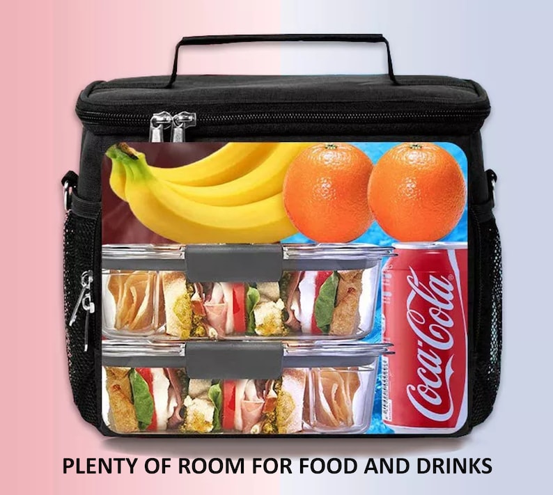 May include: Black insulated lunch bag with a top handle and side mesh pocket. The bag contains bananas, oranges, two clear food containers with sandwiches, and a Coca-Cola can. The text "PLENTY OF ROOM FOR FOOD AND DRINKS" is at the bottom.