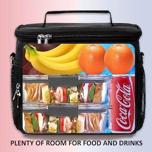 May include: Black insulated lunch bag with a zipper closure and a shoulder strap. The bag is filled with food and drinks, including sandwiches, bananas, oranges, and a can of Coca-Cola.