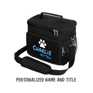 May include: Black insulated lunch bag with a white paw print and the text "CHARLIE VET TECH" in blue. The bag has a top handle and a shoulder strap.