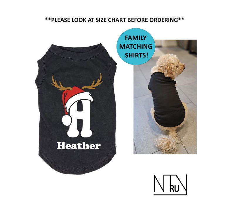 May include: Black dog shirt with a reindeer antler and Santa hat design, featuring the letter "A" and the name "Heather". The image also includes a dog wearing a black shirt and the text "FAMILY MATCHING SHIRTS!"