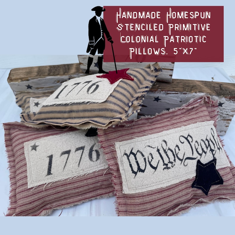 May include: Three handmade, primitive, patriotic pillows with red, white, and blue striped fabric. One pillow features the year "1776" in black lettering, another pillow features the phrase "We the People" in black lettering, and the third pillow features a red star and the year "1776" in black lettering. The pillows are 5 inches by 7 inches.
