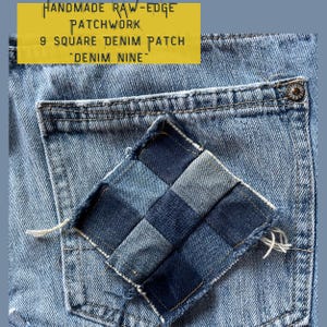 May include: A close-up of a blue denim pocket with a square denim patch sewn on. The patch is made of nine smaller squares of denim in different shades of blue. The text "HANDMADE RAW-EDGE PATCHWORK 9 SQUARE DENIM PATCH "DENIM NINE" is printed on a yellow label.