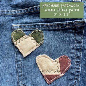 May include: Two handmade patchwork heart patches on a blue denim background. The patches are 3 inches by 2.5 inches. One patch is green and beige, the other is red, beige, and brown.