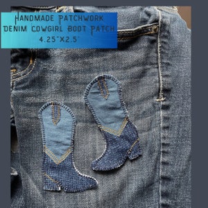 May include: Handmade denim patchwork cowgirl boot patch, 4.25" x 2.5". Two blue denim boots are sewn onto a blue denim background.