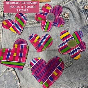 May include: Handmade patchwork hearts and flower patches in vibrant pink, blue, green, and yellow fabrics. The patches are sewn onto denim fabric. The image includes the text "HANDMADE PATCHWORK HEARTS & FLOWER PATCHES".