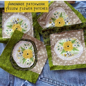 May include: Handmade patchwork squares with yellow flower patches. The patches are sewn onto a denim background.