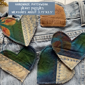 May include: Handmade patchwork heart patches in various colors, measuring approximately 3.75" x 3.5". The patches are heart-shaped and made from different patterned fabrics. The image also shows a brown leather tag with the word "AEROPOSTALE".