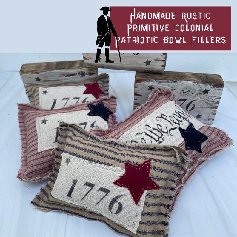 May include: Four handmade fabric bowl fillers with patriotic themes. Two are red and white striped with a white rectangle that says "1776" and a red star. One is red and white striped with a white rectangle that says "To the People" and a blue star. One is brown and white striped with a white rectangle that says "1776" and a red star.