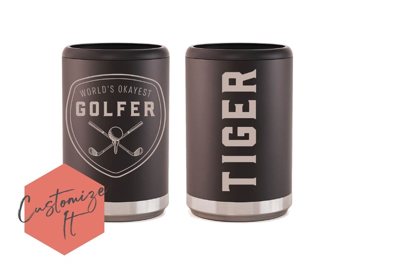 May include: Two black insulated can coolers. One cooler has the text "WORLD'S OKAYEST GOLFER" with a golf club and ball graphic. The other cooler has the text "TIGER" in large letters.