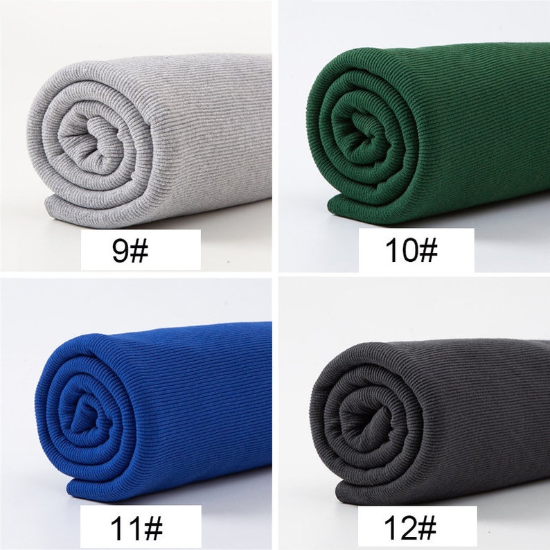May include: Four rolls of ribbed fabric in various colors. The colors include gray with the text "9#", green with the text "10#", blue with the text "11#", and dark gray with the text "12#". The fabric is tightly rolled.