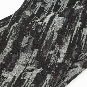 May include: Black fabric with a white textured pattern. The fabric has a slightly frayed edge.