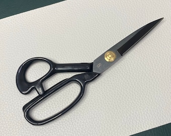 May include: Black fabric shears with a gold accent and the number "8" on the handle.