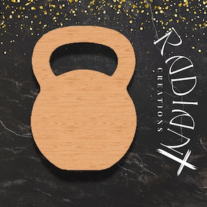 May include: A wooden kettlebell cutout with a handle, set against a dark background with gold flecks. The kettlebell is light brown with a wood grain texture. The text "Radiant Creations" is written in white.