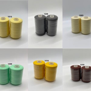 May include: Six spools of thread in various colors, including yellow, green, gray, brown, and orange. Each spool is labeled with a number, such as 1013, 1245, 1003, 1099, 1018, and 1232.