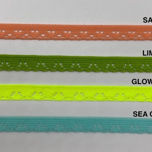 May include: Four samples of elastic trim with a delicate lace pattern. The trim colors are salmon, limeade, glowstick, and sea glass.